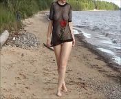 Rosa walks and changes clothes on the beach from beach change