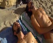 Two gay friends stroking at the beach from two gay