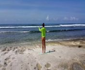 Naked YOGA # Morning Yoga exercises at Ocean Shore from beach feet
