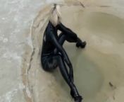 Super Hot Blond Girl In Black Latex Catsuit + High Heels And Sunglasses Bathes In The Mud - Mud Bath from mugd